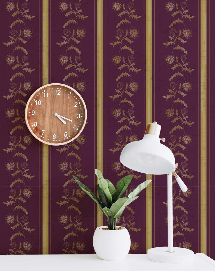 Globe thistle line drawing in gold with alternating stripe pattern on a deep plum burgundy back